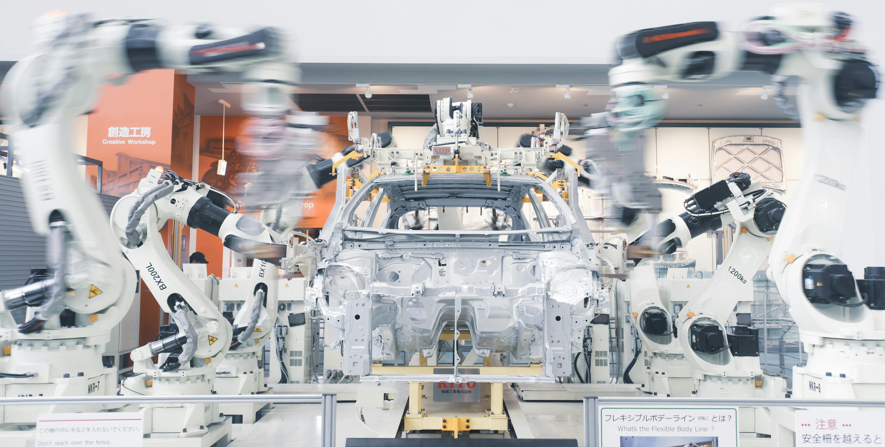 Industrial robots collaborating on a factory line